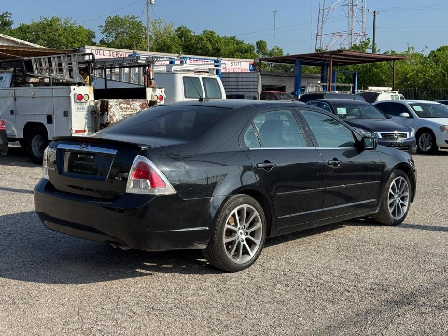 2009 BLACK FORD FUSION SEL (3FAHP08Z39R) with an 2.3L engine, Automatic transmission, located at 1507 S Hwy 67, Cedar Hill, TX, 75104, (972) 293-1833, 32.556370, -96.973297 - Photo#2