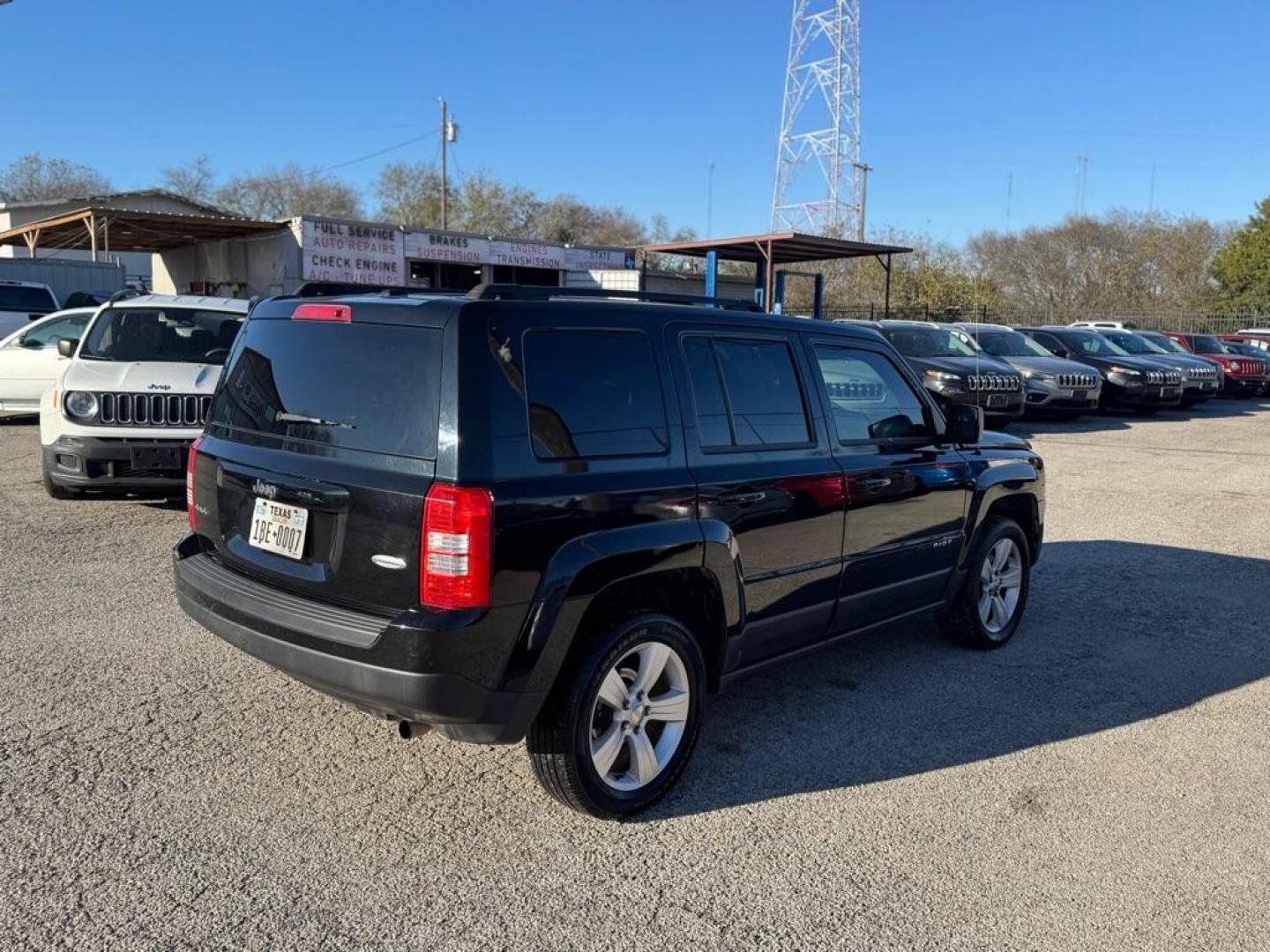 2014 BLACK JEEP PATRIOT LATITUDE (1C4NJRFB3ED) with an 2.4L engine, Continuously Variable transmission, located at 1507 S Hwy 67, Cedar Hill, TX, 75104, (972) 293-1833, 32.556370, -96.973297 - Photo#2