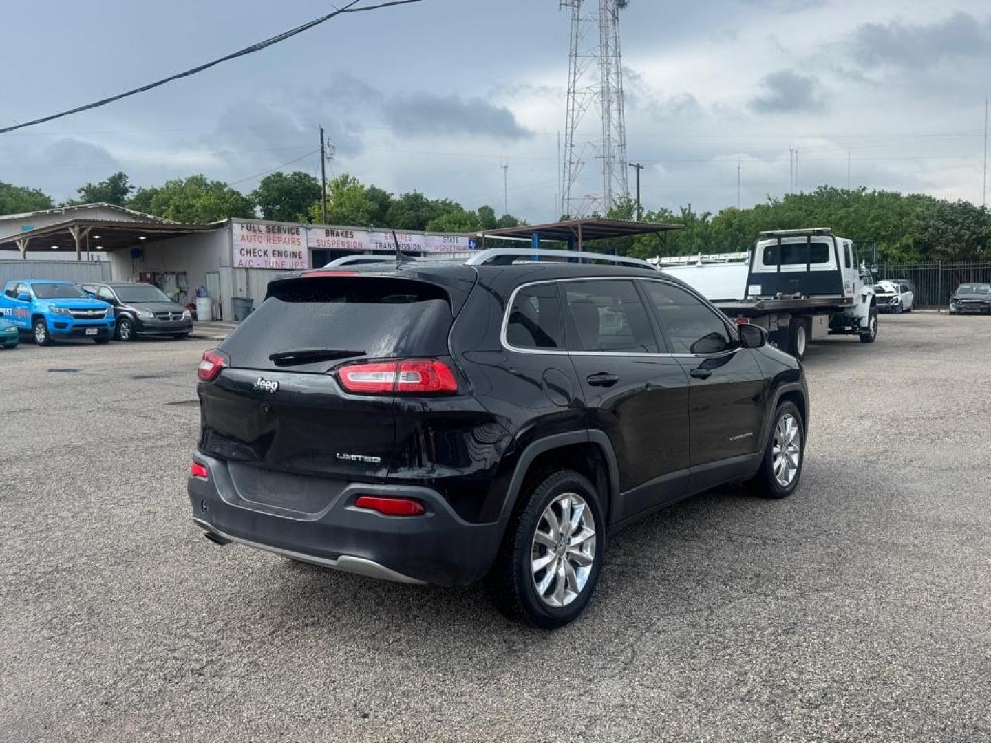 2016 BLACK JEEP CHEROKEE LIMITED (1C4PJLDB2GW) with an 2.4L engine, Automatic transmission, located at 1507 S Hwy 67, Cedar Hill, TX, 75104, (972) 293-1833, 32.556370, -96.973297 - Photo#2